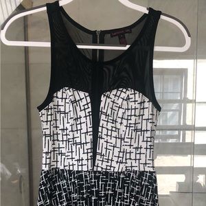Material Girl mini dress, varied black pattern with net tank top